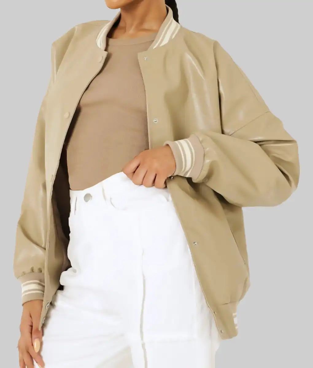 Beige leather varsity jacket for women by Lush Wear styled with white pants and a tan top