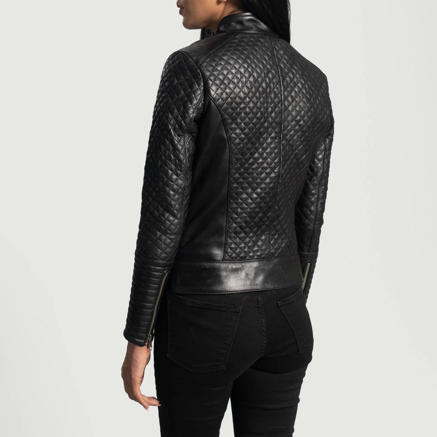 Back view of black leather biker jacket with quilted pattern worn by model from Lush Gear