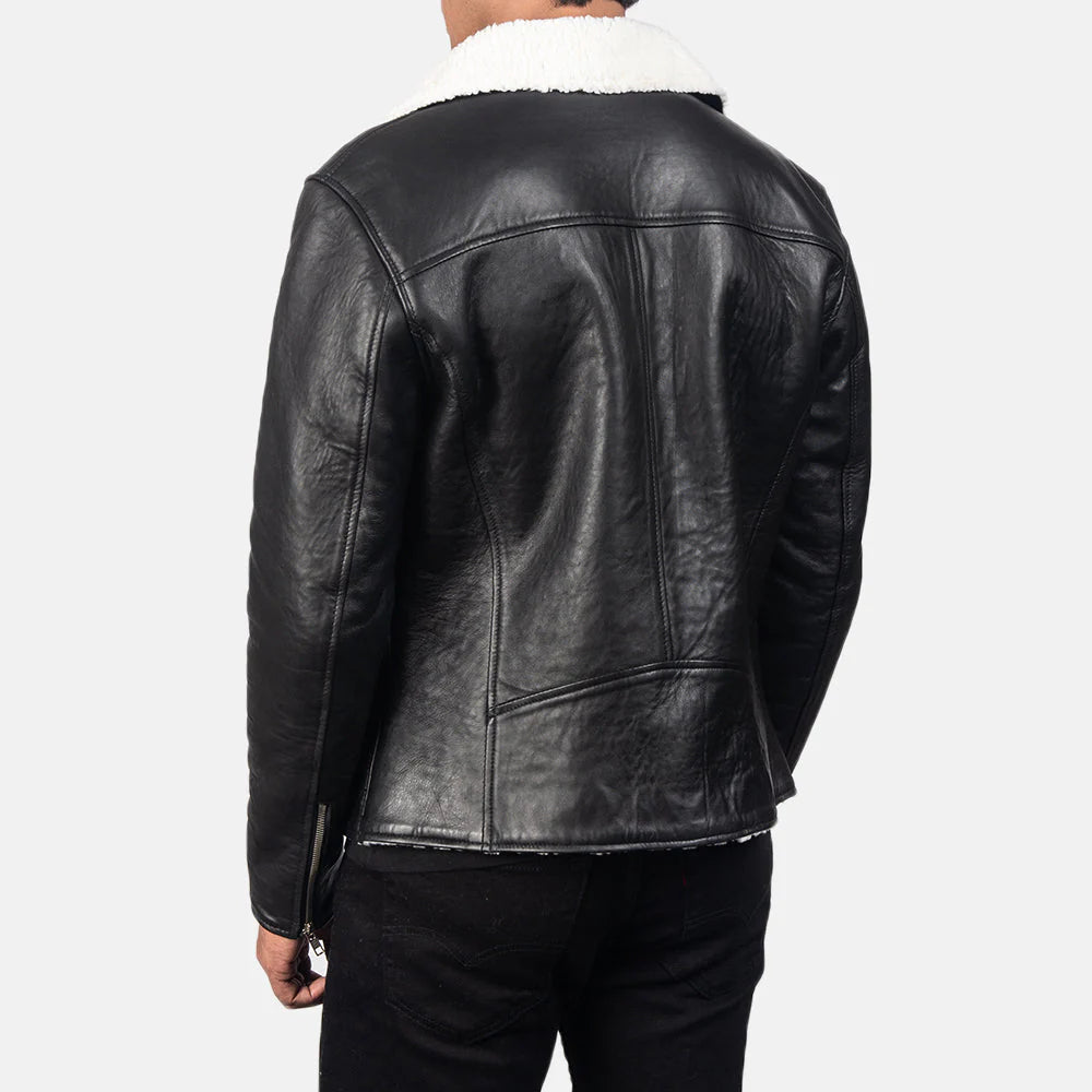 Back view of a black leather shearling jacket with white shearling collar worn by a male model