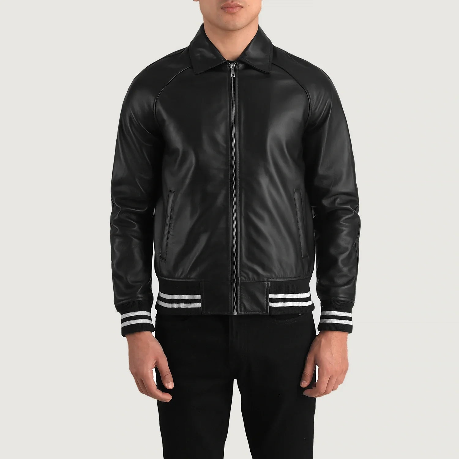Lush Gear black leather varsity jacket with front zipper and striped cuffs modeled on man
