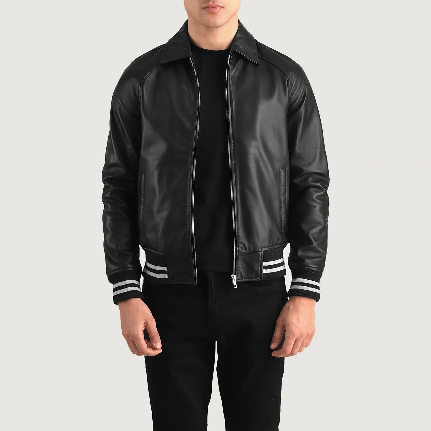 Lush Gear black leather varsity jacket with white striped cuffs and waistband on male model