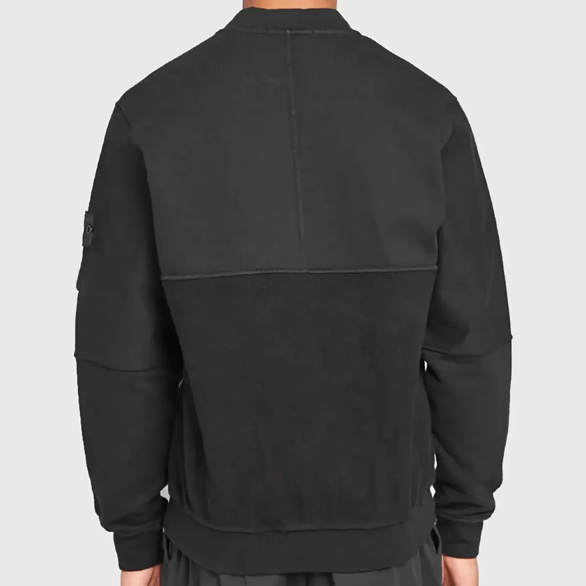 Back view of a black suede bomber jacket by Lush Gear with a two-tone design and ribbed cuffs