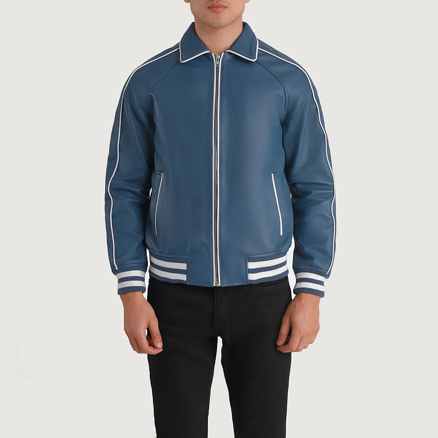 Blue leather varsity jacket with white trim and zip front, worn by male model