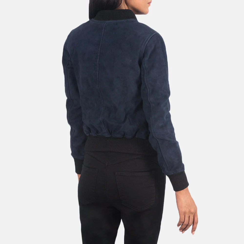 Back view of a model wearing a blue suede bomber jacket by Lush Gear with ribbed cuffs and waistband