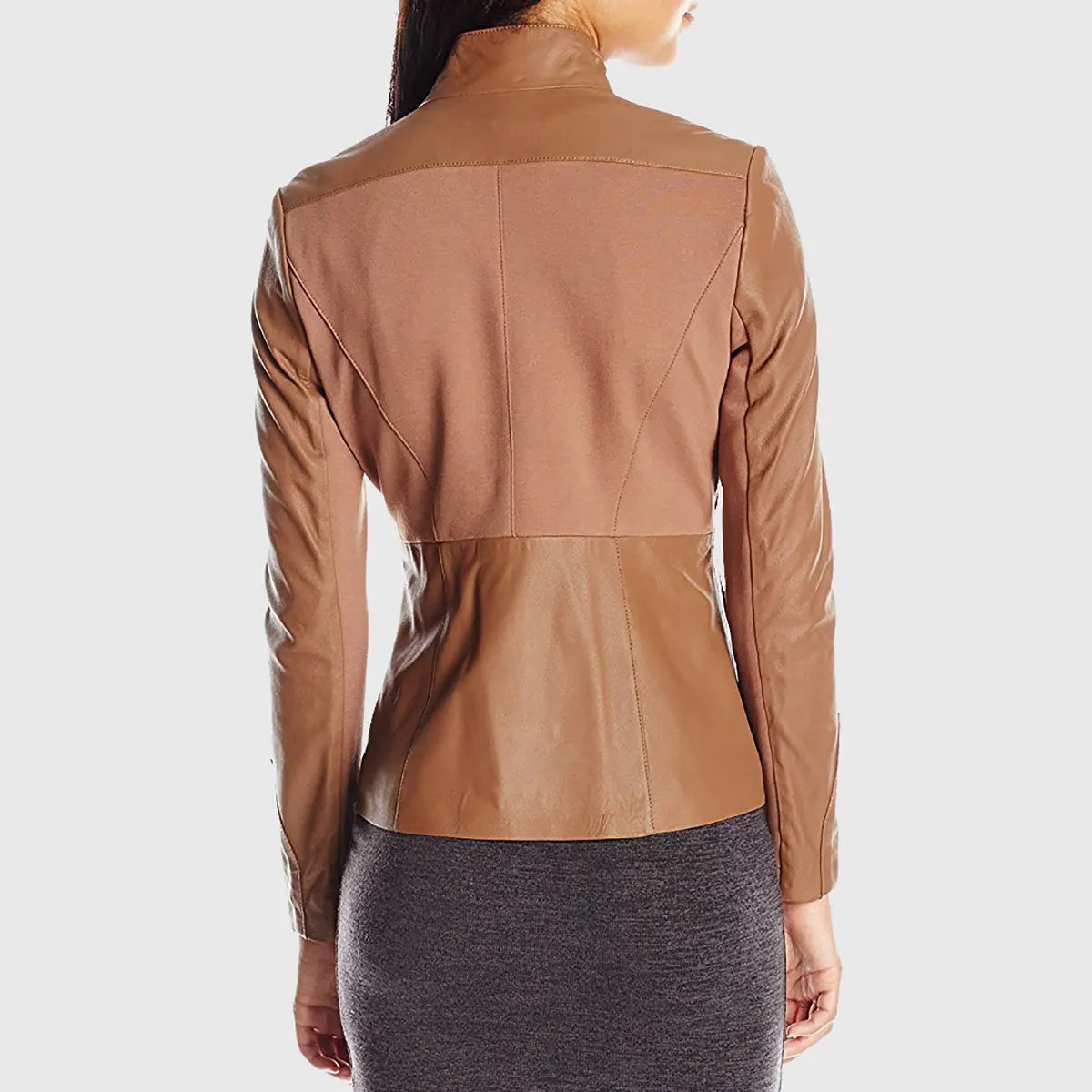 Back view of a brown leather biker jacket worn by a woman with a fitted design and high collar