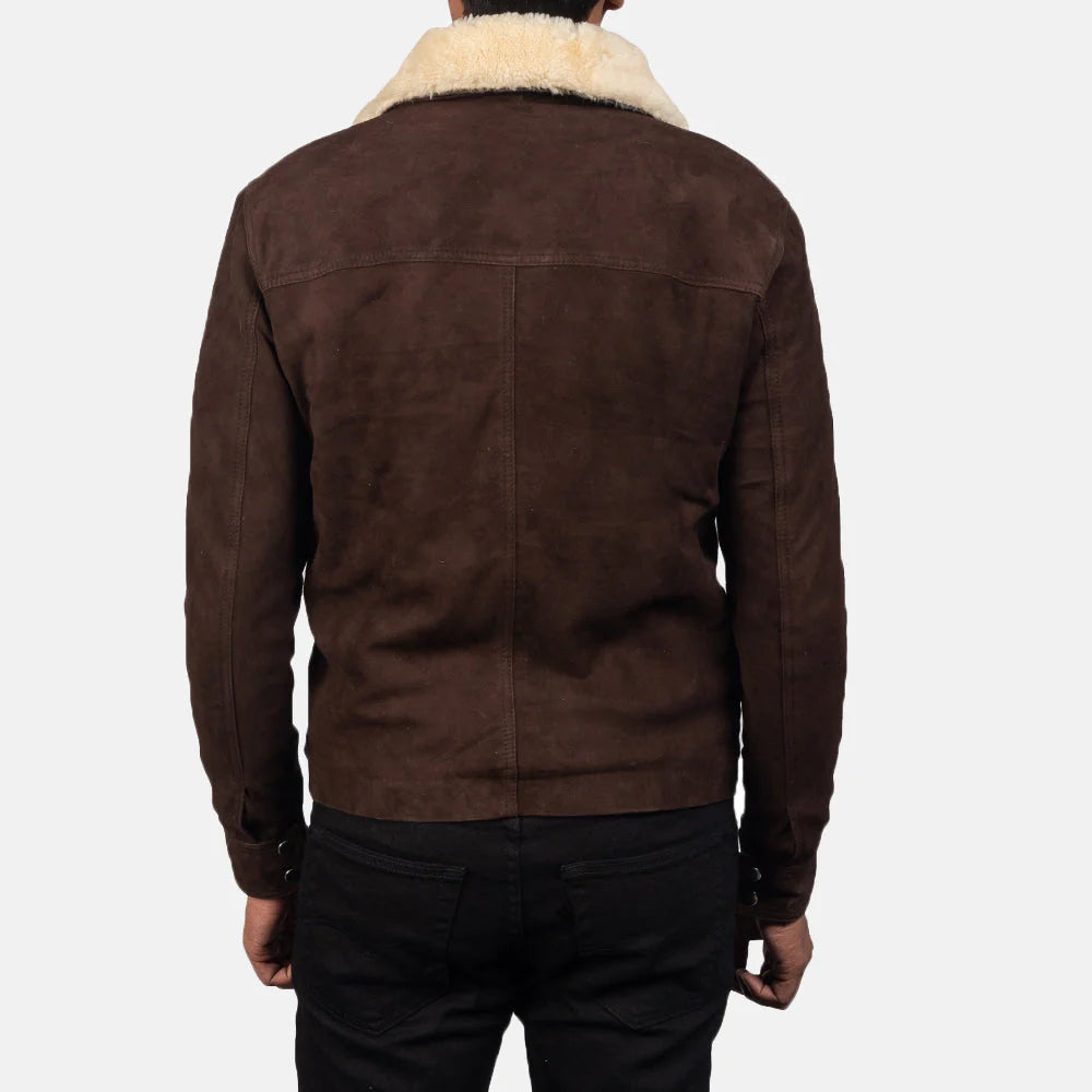 Back view of brown shearling fur jacket with cream collar worn by person in black pants