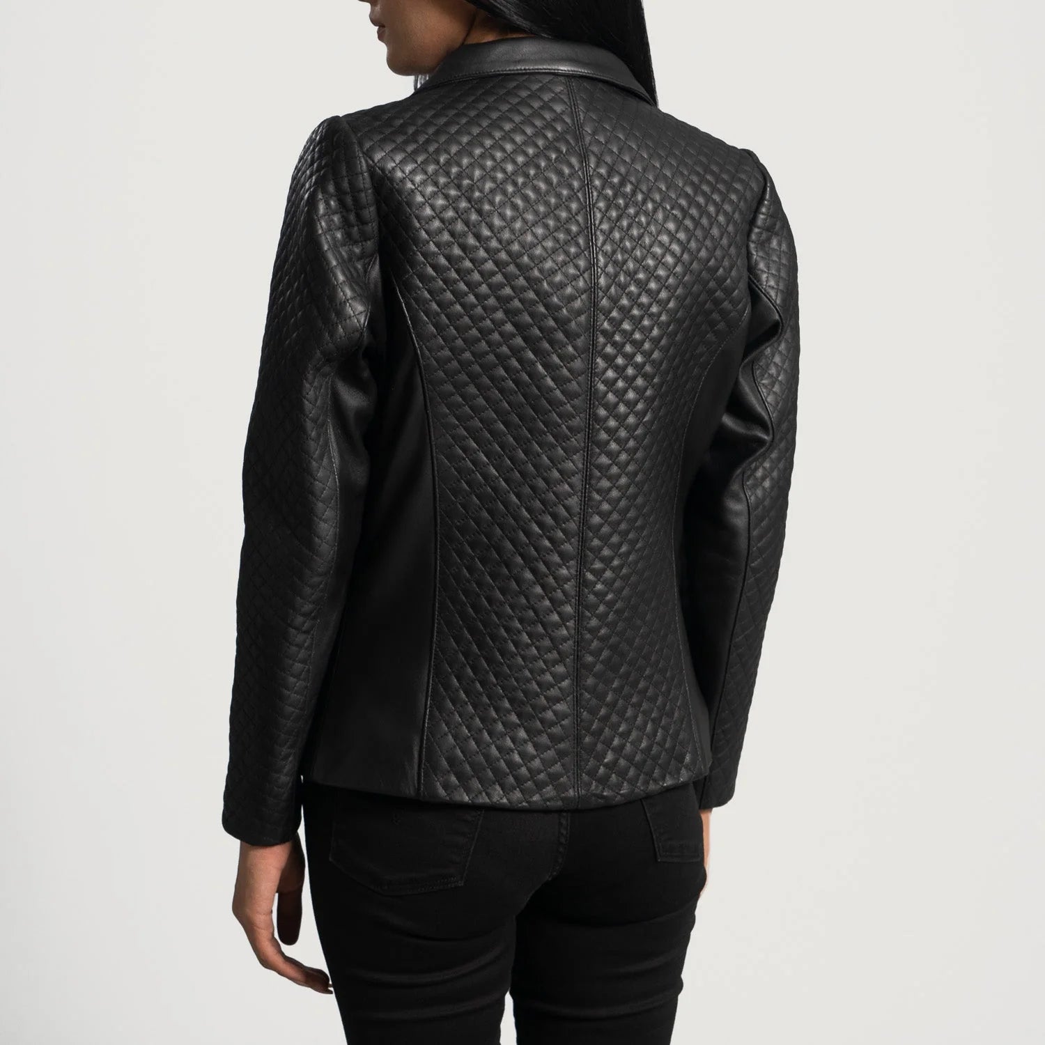 Back view of Cora Quilted Black Leather Blazer by Lush Gear on model wearing black pants