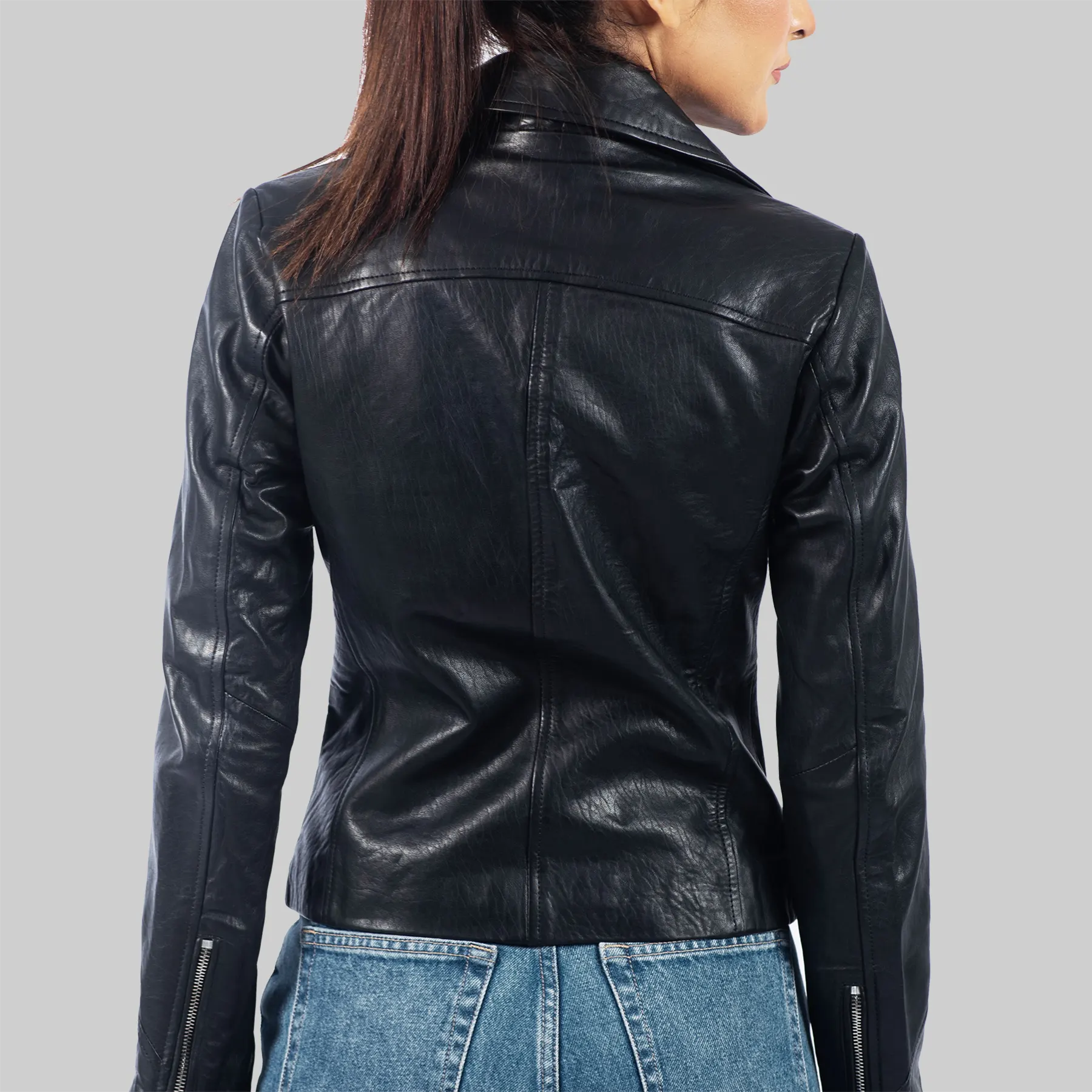 Back view of black leather motorcycle jacket for women worn with blue jeans by Lush Gear