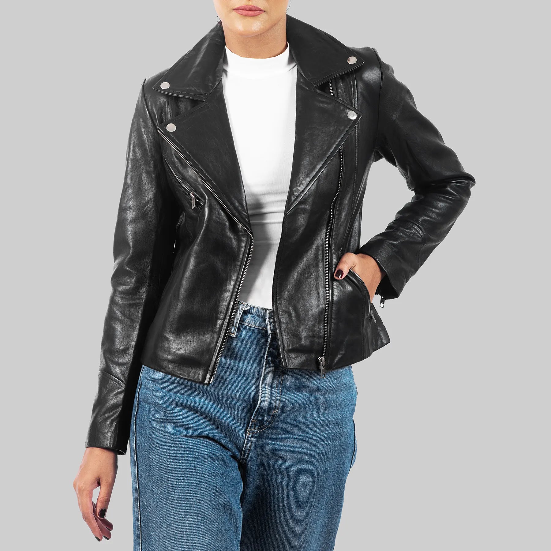 Black leather motorcycle jacket for women styled with white top and blue jeans by Lush Gear