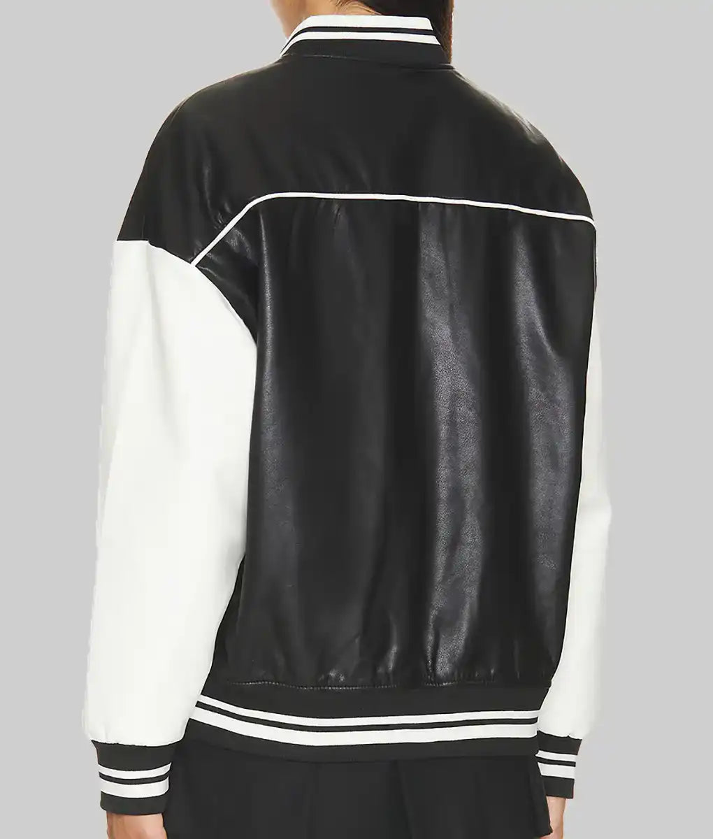 Back view of black and white leather varsity jacket for women by Lush Gear with striped cuffs and collar