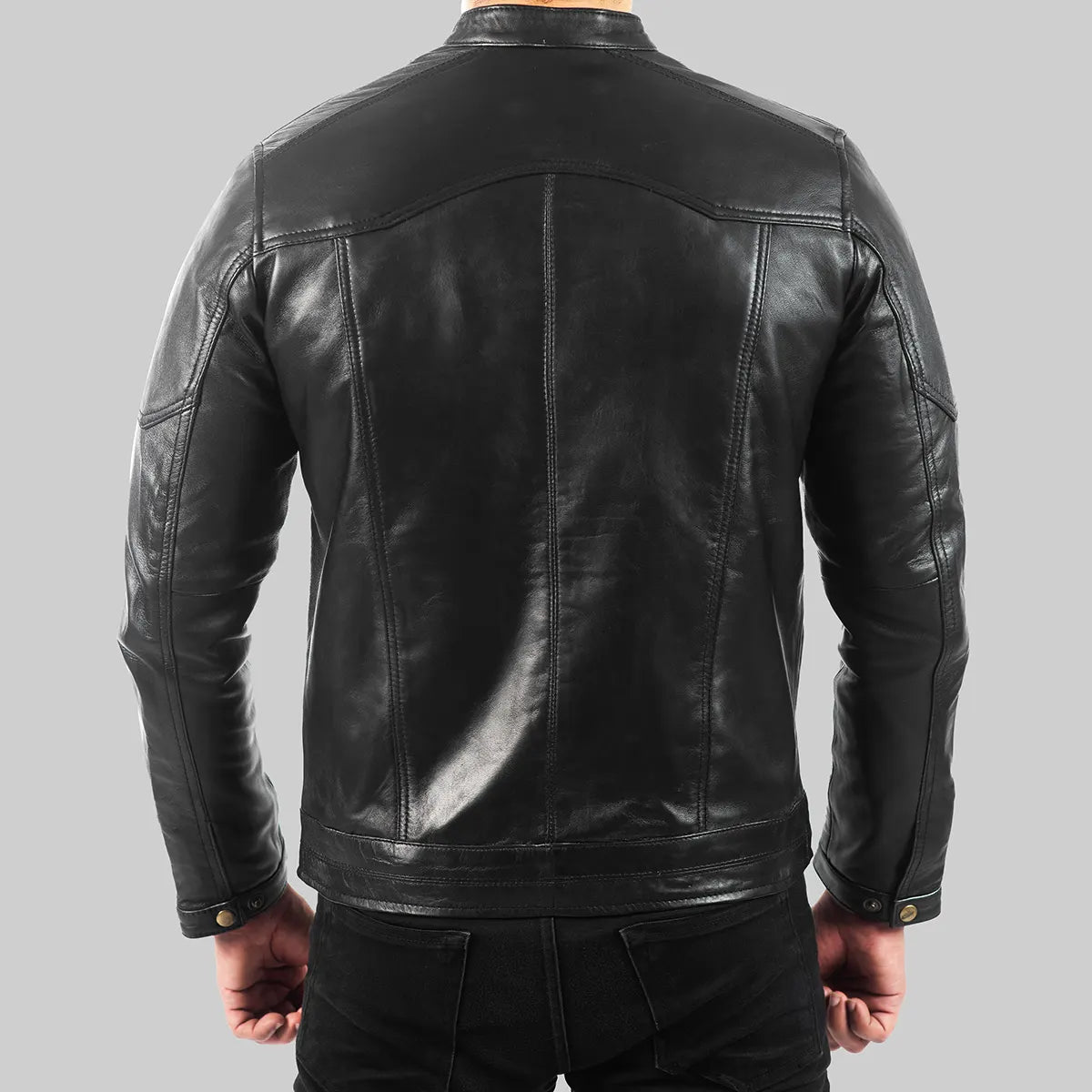 Back view of men's black quilted leather biker jacket by Lush Gear with detailed stitching and buttoned cuffs