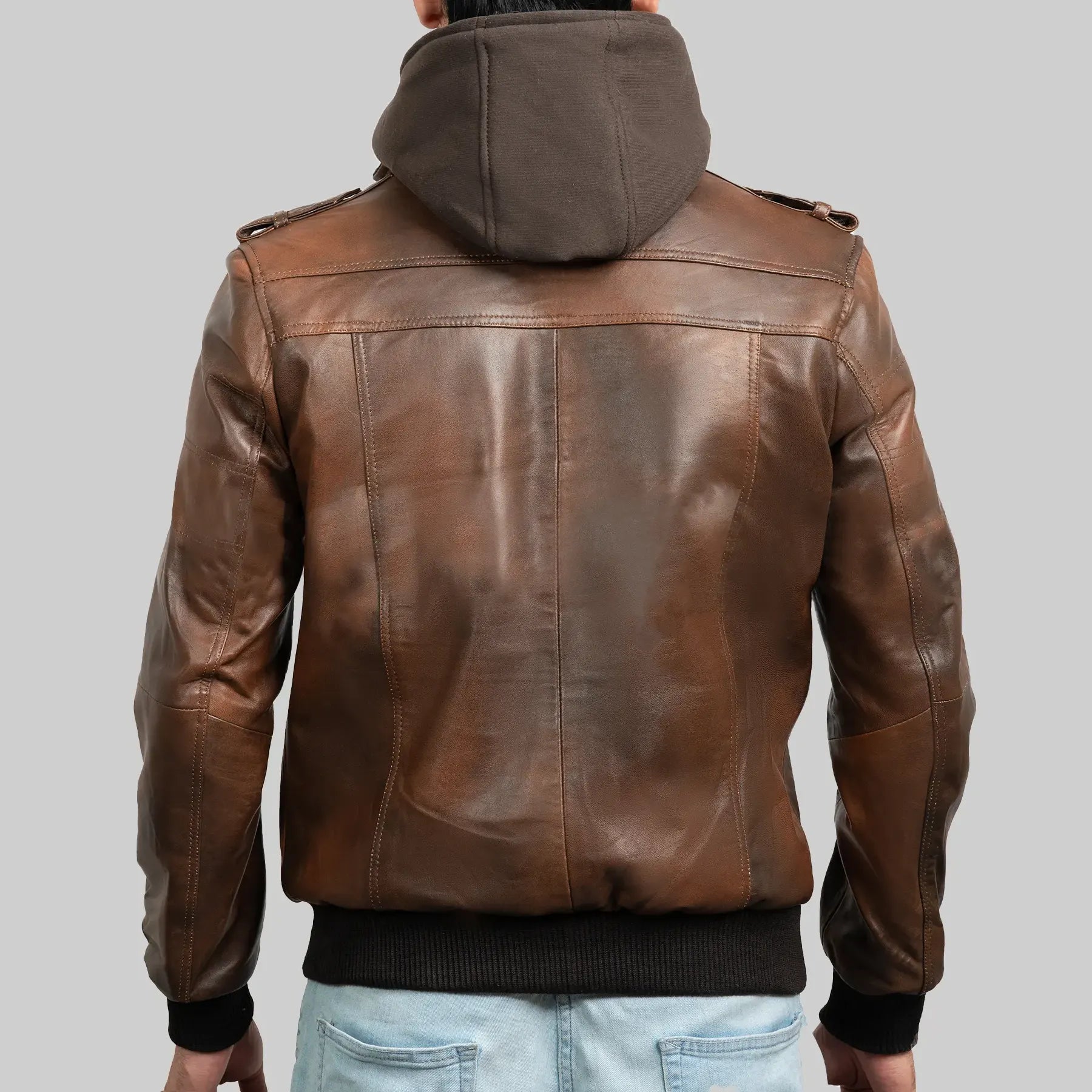 Back view of men's brown leather biker jacket by Lush Gear with black cuffs and waistband