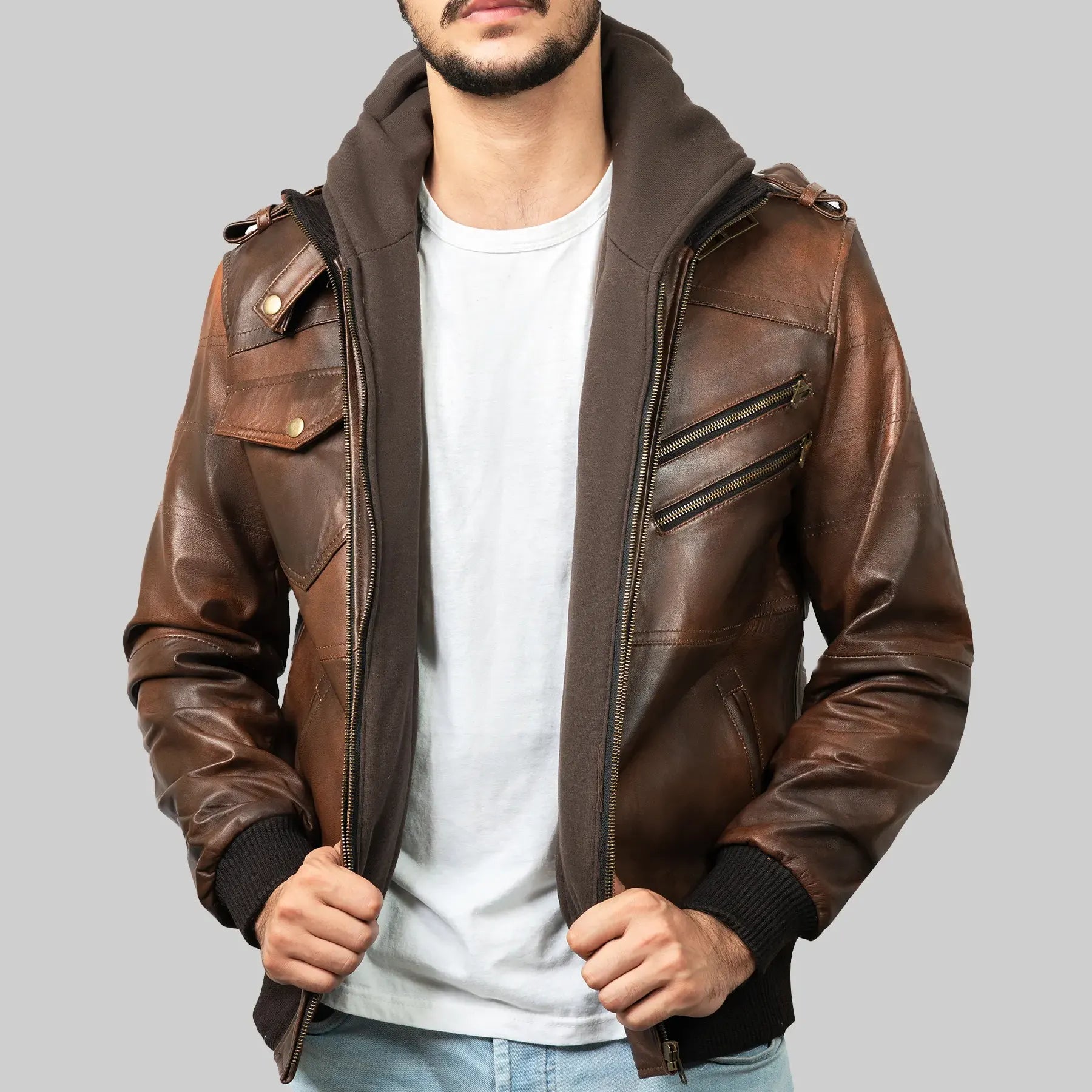 Lush Gear men's brown leather biker jacket with zip and button details worn over a hoodie