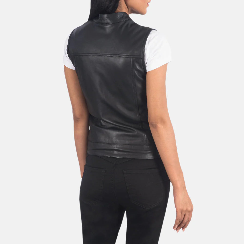 Back view of Rayne Moto Black Leather Vest by Lush Gear worn over a white shirt with black pants