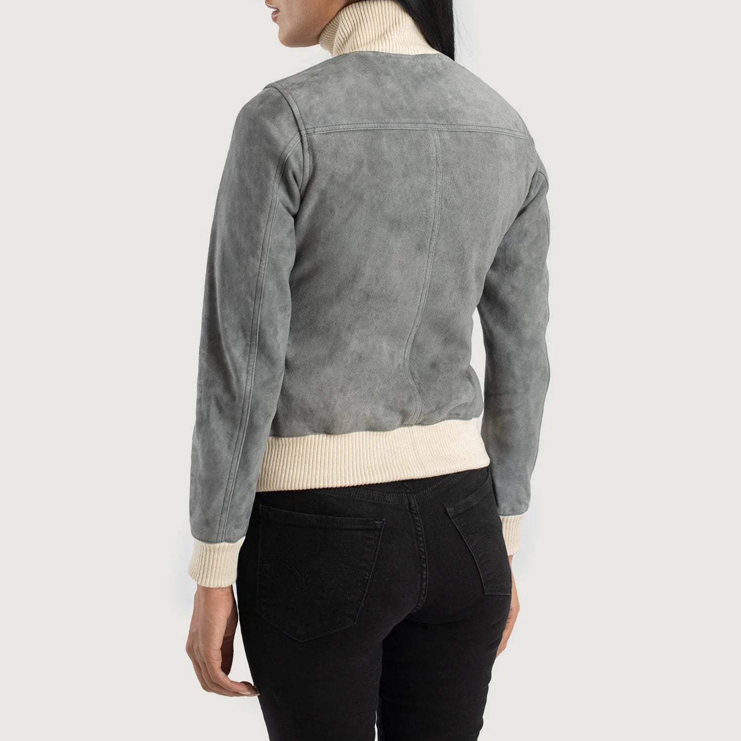 Back view of Sasha A1 Grey Suede Bomber Jacket by Lush Gear on woman wearing black pants and cream turtleneck