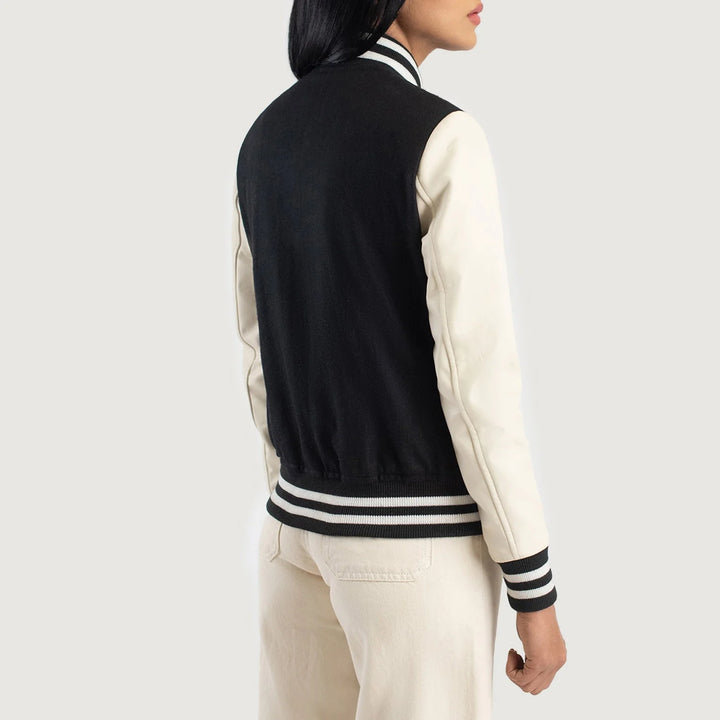 Back view of Savant Black & White Hybrid Varsity Jacket by Lush Gear on a model wearing light pants
