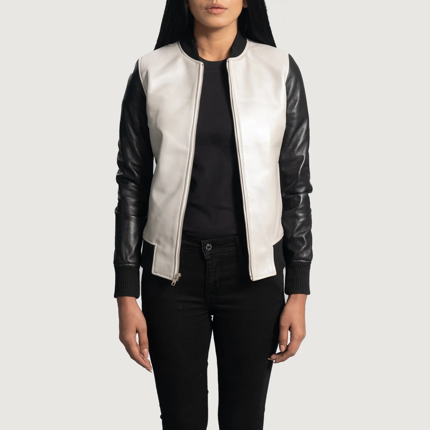 Lush Gear silver leather bomber jacket with black sleeves worn by a woman with black shirt and pants