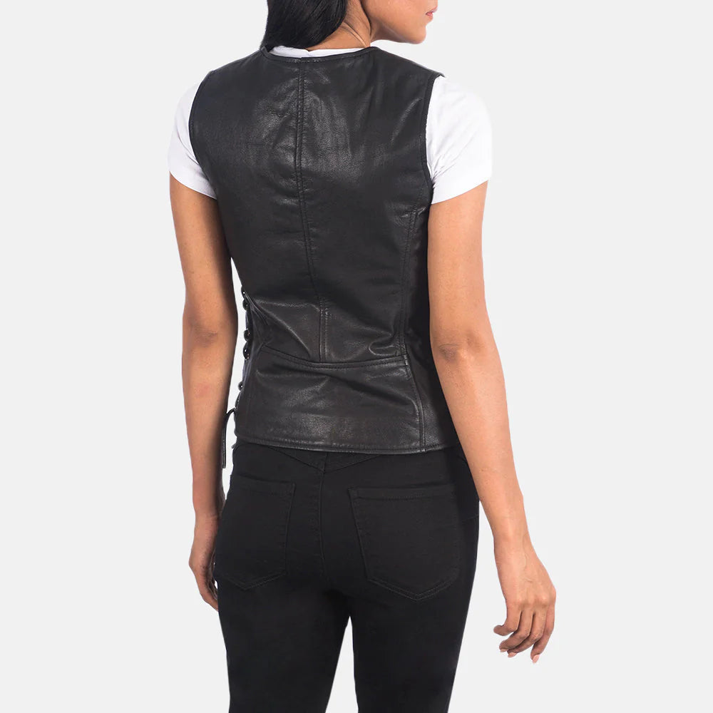 Back view of Vanda Black Leather Biker Vest worn by a woman over a white t-shirt