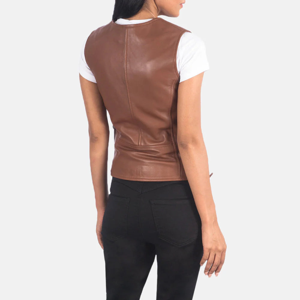 Back view of woman wearing Vanda Brown Leather Biker Vest over white t-shirt with black pants