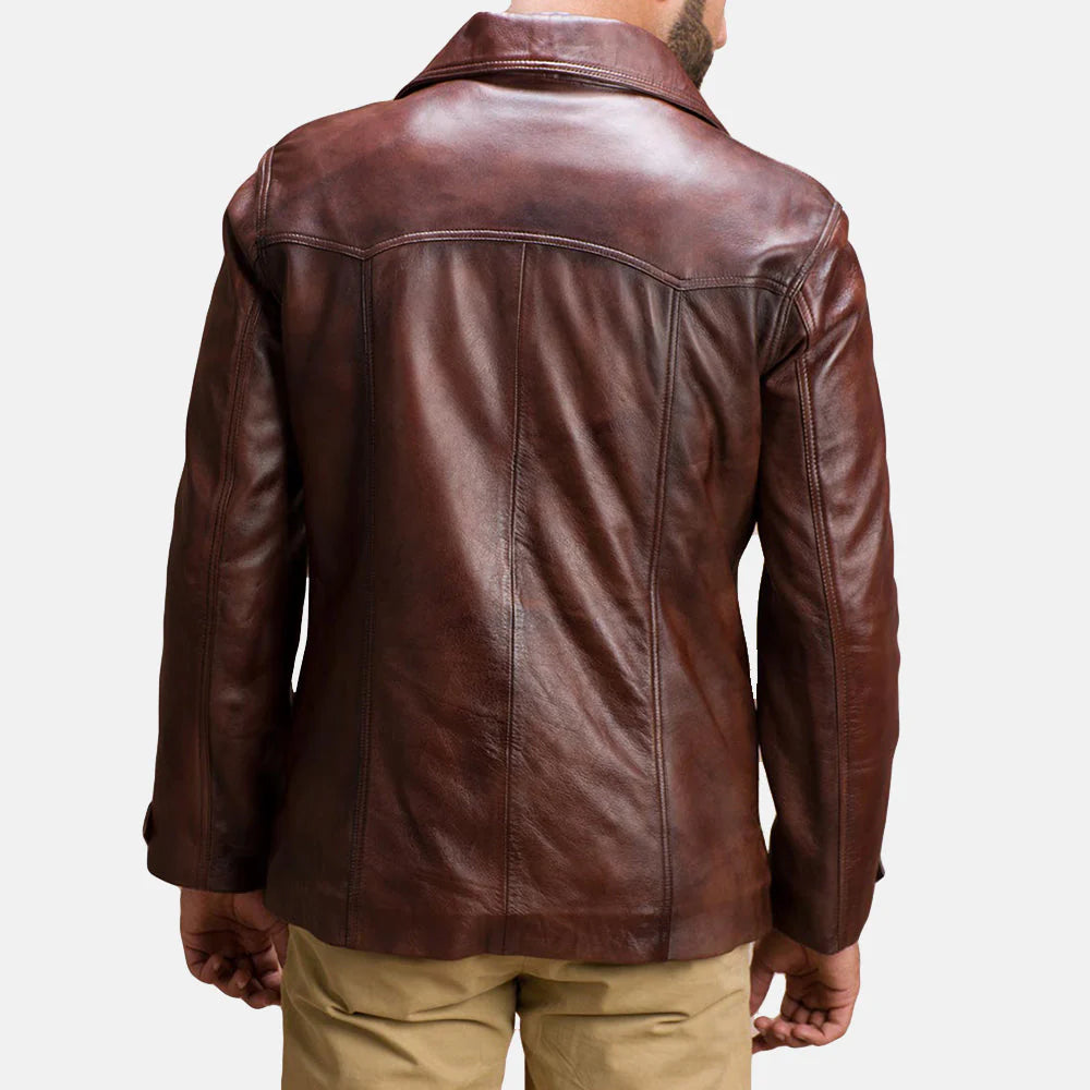 Back view of vintage style brown leather jacket by Lush Wear worn by a man with beige pants