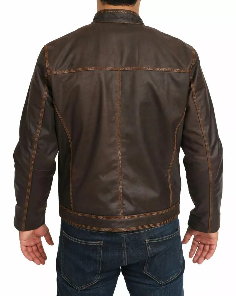 Back view of a man wearing a brown waxed cowhide motorcycle jacket by Lush Gear paired with blue jeans