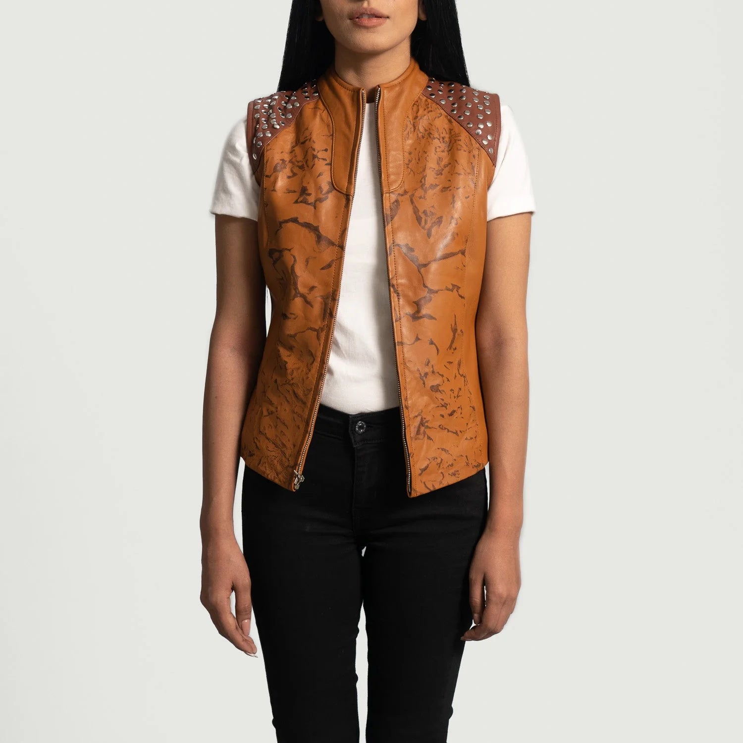 Westina Tan Dye Leather Vest by Lush Gear with studded shoulders worn over white t-shirt and black pants