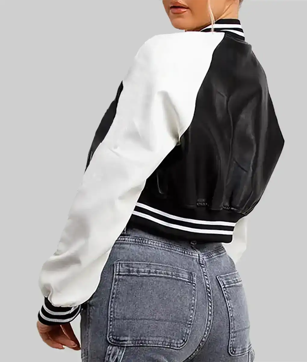 Lush Gear women's black and white varsity jacket with striped cuffs and waistband shown from back