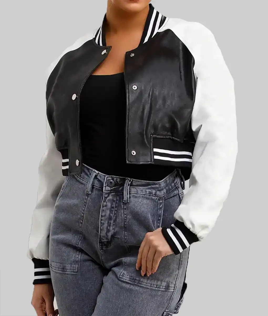 Lush Gear women's black and white varsity jacket with striped cuffs and collar worn with high-waisted jeans
