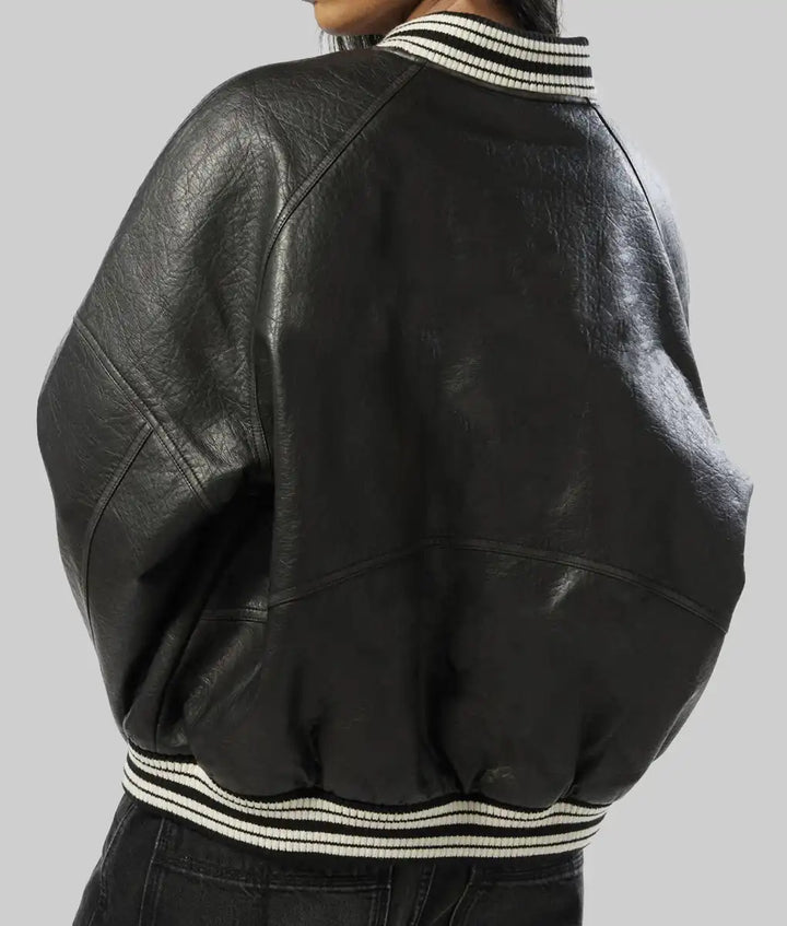 Back view of women's black leather varsity jacket with striped collar and hem by Lush Gear