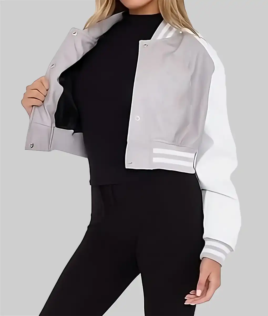 Lush Wear women's cropped varsity jacket in gray and white with striped cuffs and snap buttons