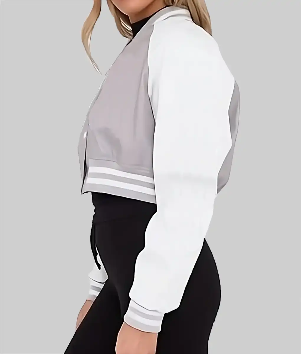 Lush Wear women's cropped varsity jacket in gray with white sleeves and striped cuffs