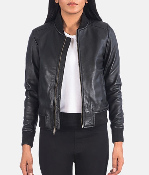 Lush Gear black women's leather bomber jacket with zipper front and ribbed cuffs worn over white top