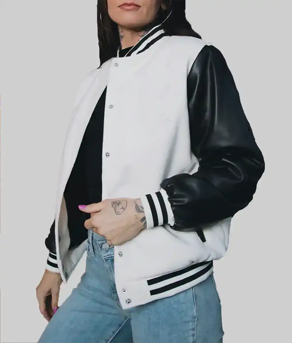 Lush Gear women's leather varsity jacket with black sleeves and white body styled with jeans