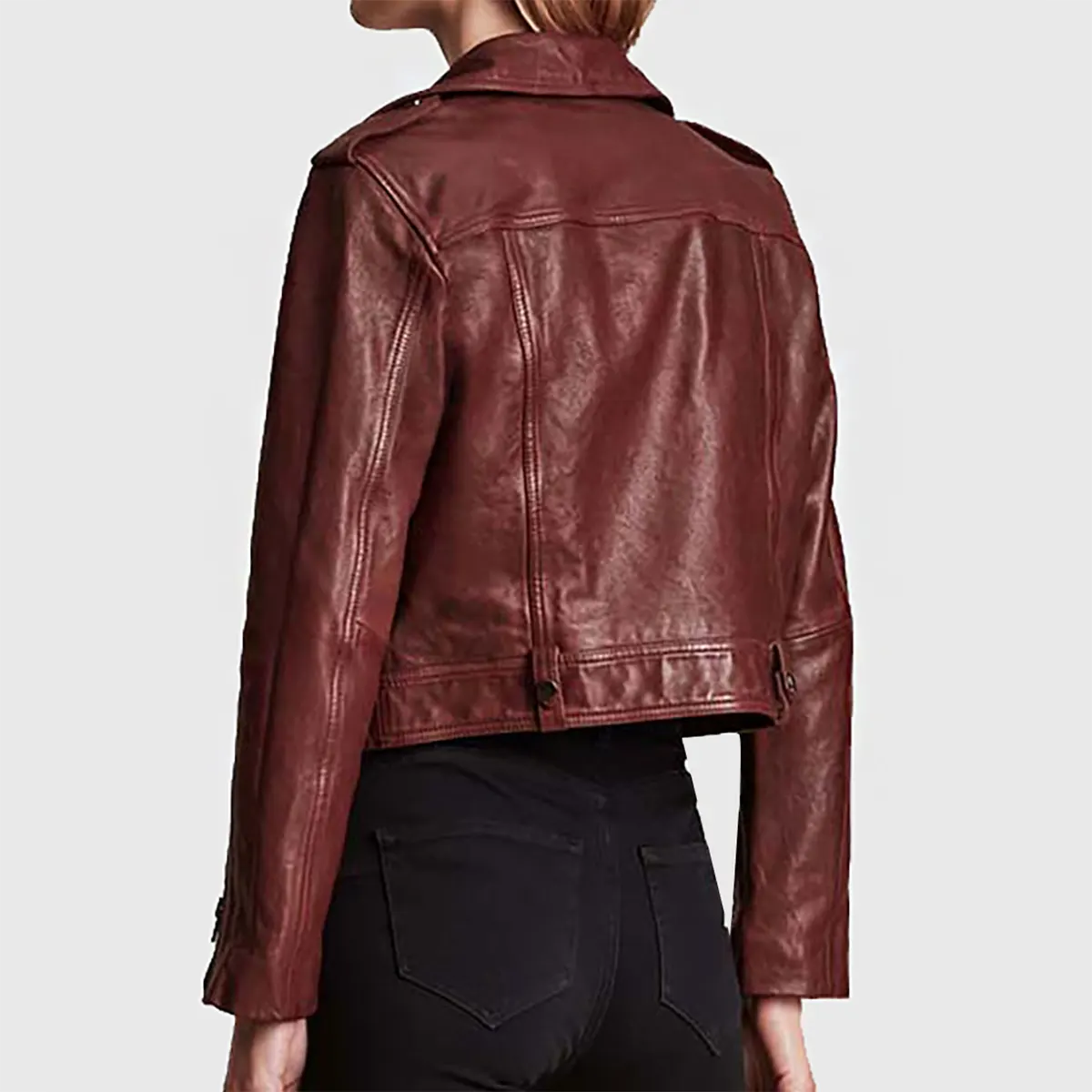 Back view of women's maroon leather biker jacket from Lush Gear styled with black pants