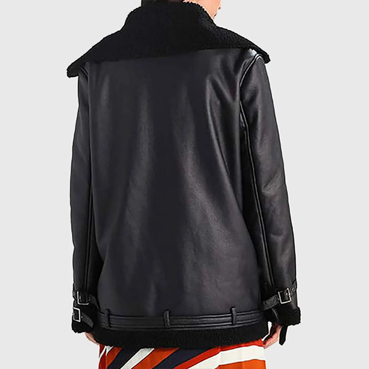 Back view of women's oversized leather bomber jacket in black with shearling collar and buckle details