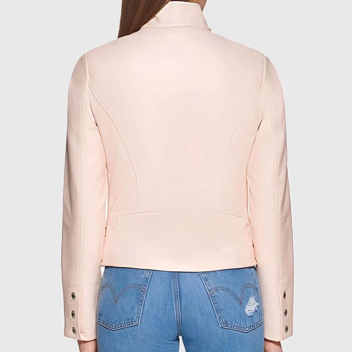 Back view of women's pink biker leather jacket by Lush Gear styled with blue denim jeans