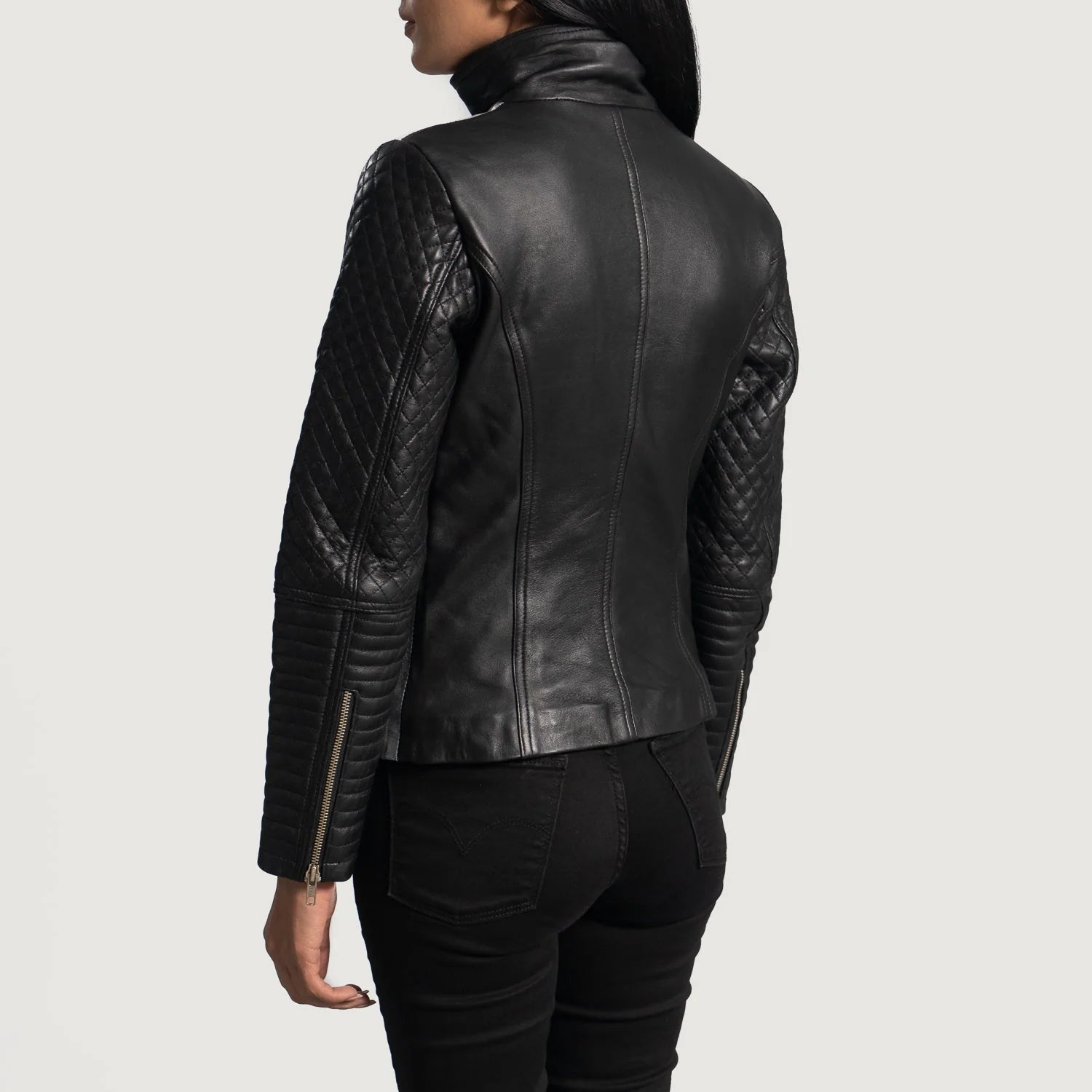 Rear view of women's quilted leather moto jacket by Lush Gear with quilted sleeves and sleek fit