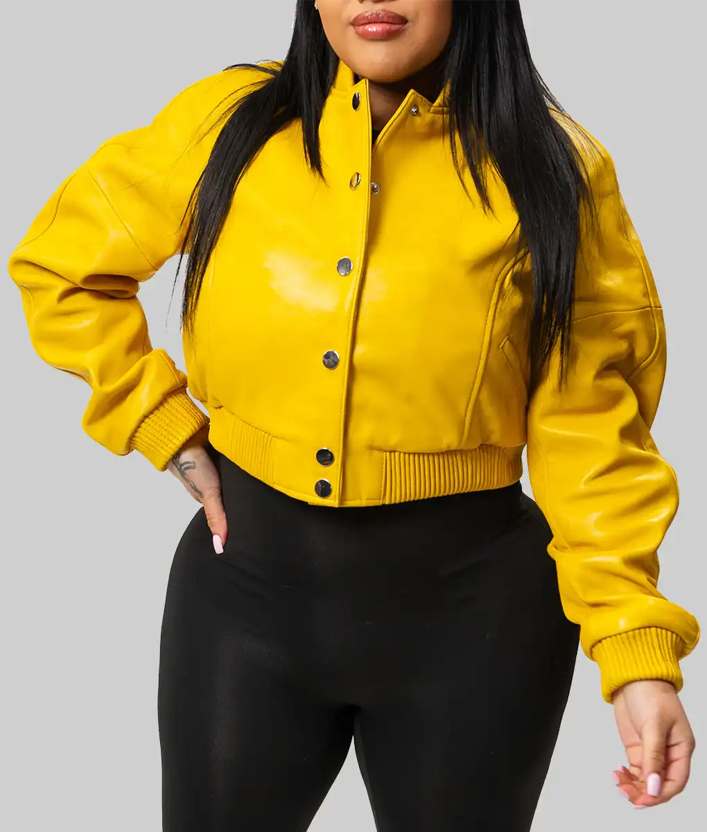 Lush Gear yellow varsity jacket for women with snap buttons and ribbed cuffs worn with black pants